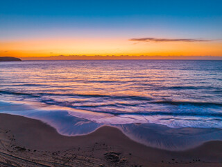 Fototapeta premium Sunrise at the seaside with orange horizon