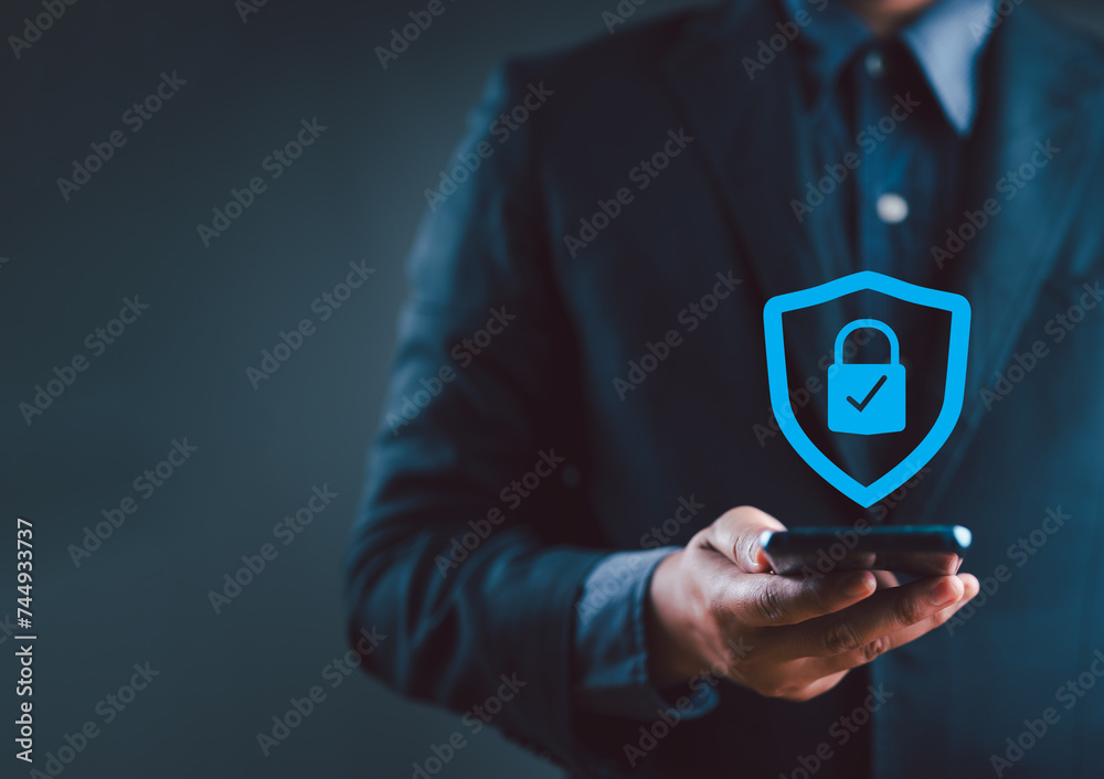 Fototapete Cyber ​​security and data protection, businessman using smartphone internet network security, protect business and financial transaction data from cyber attack, user private data security encryption.
