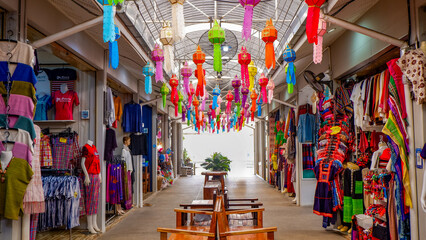 Lanterns hanging on the ceiling of a traditional shopping street in Thailand