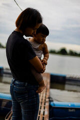 Mother And Son At The Fish Farm