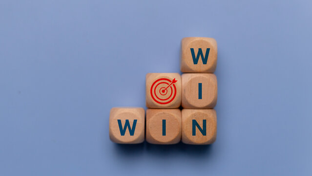 Wooden cubes with Target goal icon and win-win situation. Wooden cubes stack with text win-win situation. copy space