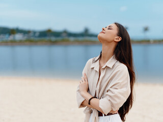 Carefree Summer: A Young, Attractive Female Enjoying the Beach, Feeling the Wind in Her Hair and Embracing the Freedom of Nature