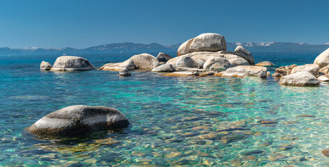 North Shore of Lake Tahoe Secret Harbor with giant granite boulders in clear blue turquoise water...