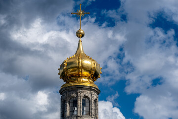 Fototapeta na wymiar A church with domes against the sky.