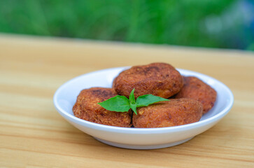 Perkedel or bergedel is a typical Indonesian dish made from potatoes, either fried or boiled before being mashed. They are then mixed with minced meat, sliced ​​scallions, celery leaves, and seasoning