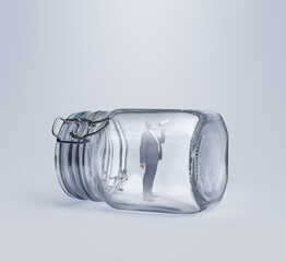 Businessman trapped inside a jar and using a megaphone