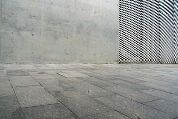 empty concrete floor in front of modern buildings in the downtown street. copy space for parking...