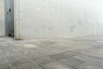 empty concrete floor in front of modern buildings in the downtown street. copy space for parking lot. - Powered by Adobe