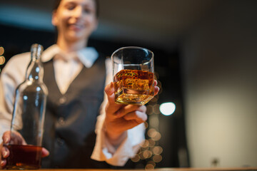 Barman pouring whiskey whiskey glass beautiful night