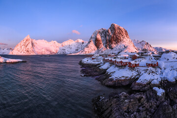 Traditional Norwegian fisherman's cabins, rorbuer, on the island of Hamnoy, Reine on the Lofoten at sunrise time Norway.