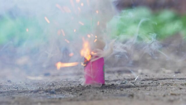 people set off fireworks on the ground