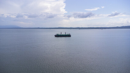 Aerial view of a large ship carrying containers in the Kalimantan sea, shipping containers, inter...