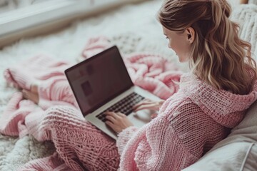 An adult embodies modern adult education by balancing work and study online on a laptop at home.