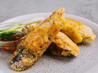 close up fried fish fillet with vegetables