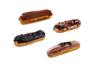 Eclairs with Chocolate Cream and Hazelnuts on White background