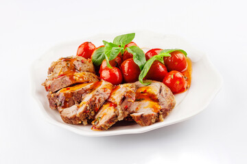 Baked meatloaf with spinach and tomatoes isolated on white