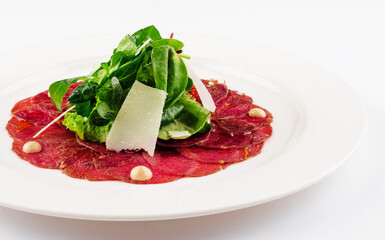 Beef carpaccio with parmesan cheese close up