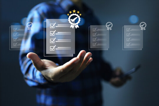 hand get approved certification with check mark on the document means that it has been certified to a quality standard or has passed an audit according to industry standards