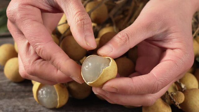 Peel the fresh longan by hand