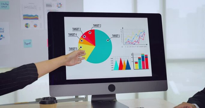 Business people dissing with chart in monitor in meeting room. Focus on monitor chart.