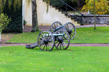 Fototapeta na wymiar Old cannon on a green lawn in the park, in Balve sauerland