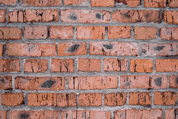 Bright red brick wall background. Red brick texture. Old Handmade brick. shabby brick with cracks