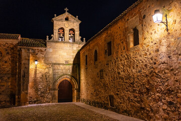 Medieval stone church at night in the monumental city of Caceres.