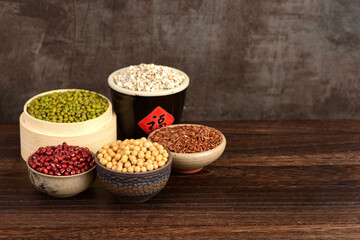 A scene of abundant crops on a retro wooden background. The meaning of the Chinese characters in...
