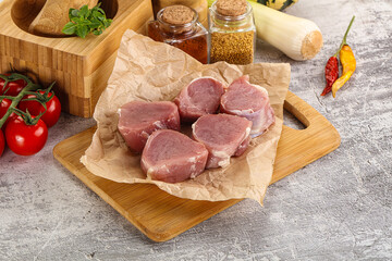 Uncooked raw pork tenderloin medallions