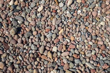 Smooth round pebbles texture background. Pebble sea beach close-up, High quality photo.