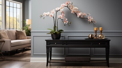 A welcoming entryway with soft gray painted walls and deep charcoal accent furniture