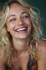 Joyful Close-up of Smiling laughing Blonde Woman. Young woman's mouth, showing white teeth, happy smile.