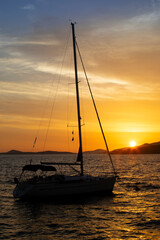 small sailboat anchored at sunset, Croatia - 745054712