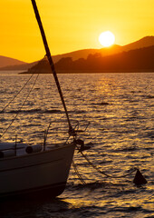 small sailboat anchored at sunset, Croatia - 745054725