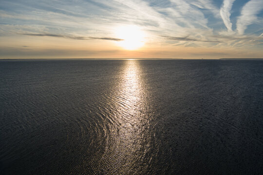 Sea sunset in the Baltic Sea, photo from a drone in winter.