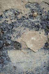 old grey stone wall abstract background. grunge aged stone texture with cracks. template for design