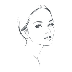 Young woman face half turn view in low key style. Elegant silhouette of a female head.