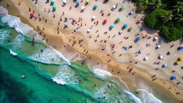 Aerial drone shot of people enjoying the beach