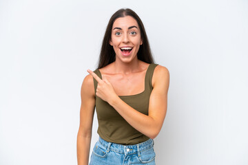 Fototapeta premium Young caucasian woman isolated on white background surprised and pointing side
