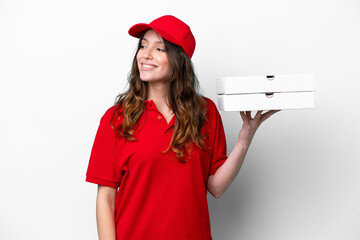 Pizza delivery woman with work uniform picking up pizza boxes isolated on white background looking...