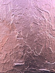 texture of a decorative wall with irregularities with a metallic sheen, which can be used as a background