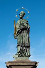   The Statue of John of Nepomuk, Charles Bridge in Prague, Czech Republic