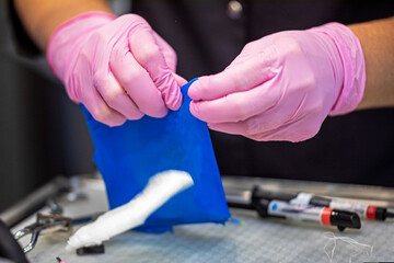 dentist puts on a rubber dental dam before treatment and restoration of the tooth. Dental care and care