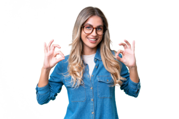 Young Uruguayan woman over isolated background showing ok sign with two hands