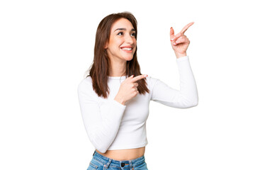 Young caucasian woman over isolated chroma key background pointing with the index finger a great idea