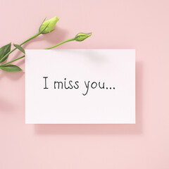 written words i miss you on card