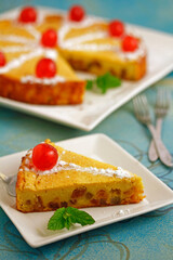 Pudding of bread and candied fruit.