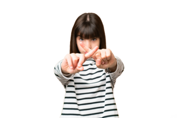 Little caucasian girl over isolated background making stop gesture with her hand to stop an act