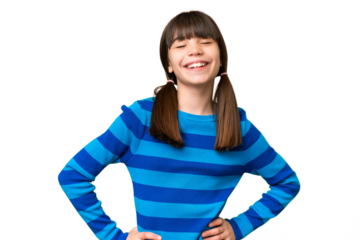 Little caucasian girl over isolated background posing with arms at hip and smiling