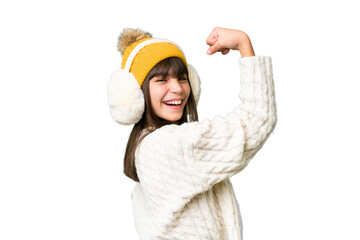 Little caucasian girl wearing winter muffs over isolated background doing strong gesture
